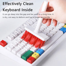 Computer cleaning brush with multiple tools, including keycap puller